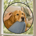 Custom Golden Retriever portrait printed on a round glass suncatcher, hanging in a bright window
